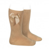 Compra Knee-high socks with grossgrain side bow CAMEL en la tienda online Condor. Fabricado en España. Visita la sección GROSGRAIN BOW SOCKS donde encontrarás más colores y productos que seguro que te enamorarán. Te invitamos a darte una vuelta por nuestra tienda online.