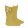 Compra Knee-high socks with grossgrain side bow MUSTARD en la tienda online Condor. Fabricado en España. Visita la sección GROSGRAIN BOW SOCKS donde encontrarás más colores y productos que seguro que te enamorarán. Te invitamos a darte una vuelta por nuestra tienda online.