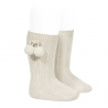 Buy Warm cotton rib knee-high socks with pompoms LINEN in the online store Condor. Made in Spain. Visit the POMPOM WARM BABY SOCKS section where you will find more colors and products that you will surely fall in love with. We invite you to take a look around our online store.
