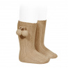 Buy Warm cotton rib knee-high socks with pompoms CAMEL in the online store Condor. Made in Spain. Visit the POMPOM WARM BABY SOCKS section where you will find more colors and products that you will surely fall in love with. We invite you to take a look around our online store.