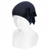 Buy Garter stitch knit hat with big velvet bow NAVY BLUE in the online store Condor. Made in Spain. Visit the ACCESSORIES FOR KIDS section where you will find more colors and products that you will surely fall in love with. We invite you to take a look around our online store.