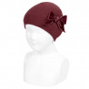 Buy Garter stitch knit hat with big velvet bow GARNET in the online store Condor. Made in Spain. Visit the ACCESSORIES FOR KIDS section where you will find more colors and products that you will surely fall in love with. We invite you to take a look around our online store.