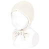 Buy the Garter sttich classic bonnet BEIGE made of 100% cotton. Available in a wide variety of colors that match the Condor tights, socks, long cardigans and short cardigan jackets, boleros for girls. Available for babies, both for boys and girls. They are unisex. Discover more models in the BONNETS section.