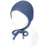 Buy the Garter sttich classic bonnet FRENCH BLUE made of 100% cotton. Available in a wide variety of colors that match the Condor tights, socks, long cardigans and short cardigan jackets, boleros for girls. Available for babies, both for boys and girls. They are unisex. Discover more models in the BONNETS section.
