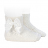 Buy Perle geometric openwork short socks satin bow CREAM in the online store Condor. Made in Spain. Visit the BABY ELASTIC OPENWORK SOCKS section where you will find more colors and products that you will surely fall in love with. We invite you to take a look around our online store.