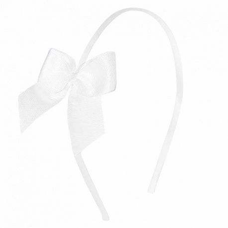 Buy Tthin headband with grosgrain bow WHITE in the online store Condor. Made in Spain. Visit the HAIR ACCESSORIES section where you will find more colors and products that you will surely fall in love with. We invite you to take a look around our online store.