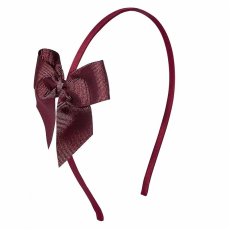 Buy Tthin headband with grosgrain bow GARNET in the online store Condor. Made in Spain. Visit the HAIR ACCESSORIES section where you will find more colors and products that you will surely fall in love with. We invite you to take a look around our online store.