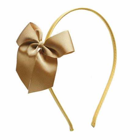 Buy Tthin headband with grosgrain bow MUSTARD in the online store Condor. Made in Spain. Visit the HAIR ACCESSORIES section where you will find more colors and products that you will surely fall in love with. We invite you to take a look around our online store.