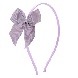 Buy Tthin headband with grosgrain bow IRIS in the online store Condor. Made in Spain. Visit the HAIR ACCESSORIES section where you will find more colors and products that you will surely fall in love with. We invite you to take a look around our online store.