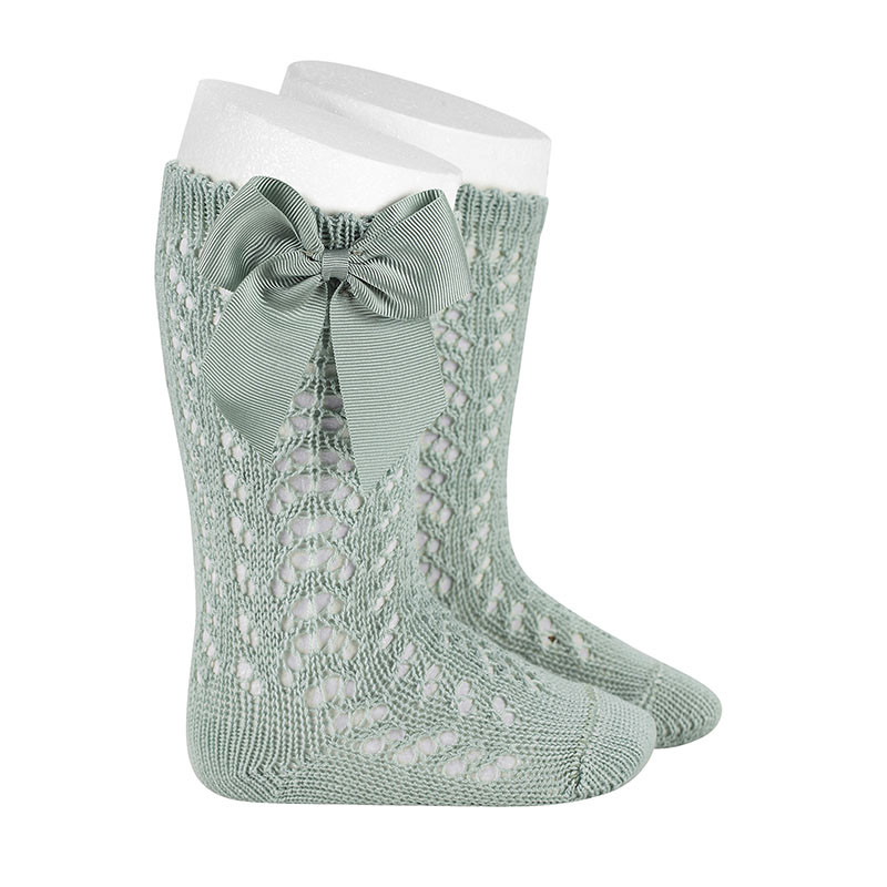 Buy Perle openwork knee-high socks with grosgrain bow SEA MIST in the online store Condor. Made in Spain. Visit the BABY OPENWORK SOCKS section where you will find more colors and products that you will surely fall in love with. We invite you to take a look around our online store.