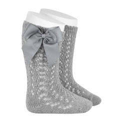 Buy Perle openwork knee-high socks with grosgrain bow ALUMINIUM in the online store Condor. Made in Spain. Visit the BABY OPENWORK SOCKS section where you will find more colors and products that you will surely fall in love with. We invite you to take a look around our online store.